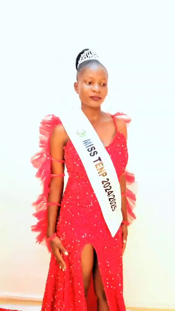 Leah Akoth Ochieng at a photo shoot, in a red dress with the Miss TENP 2024/25 sash.